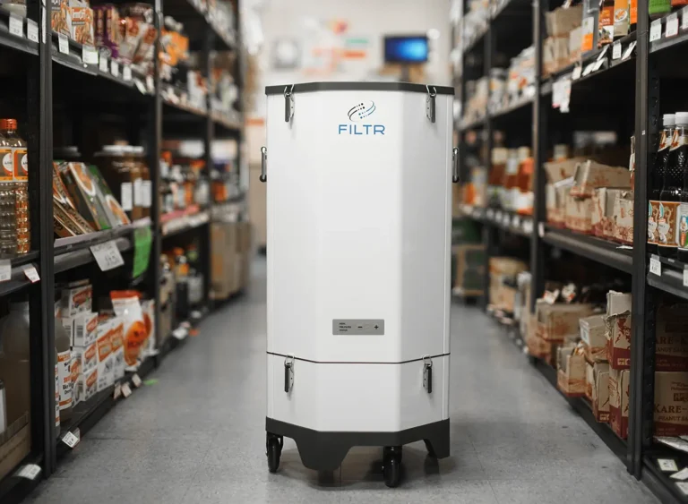 A photograph of the FILTR Revolution air purifier between the shelves at an Asian grocery store in Medford, Oregon.
